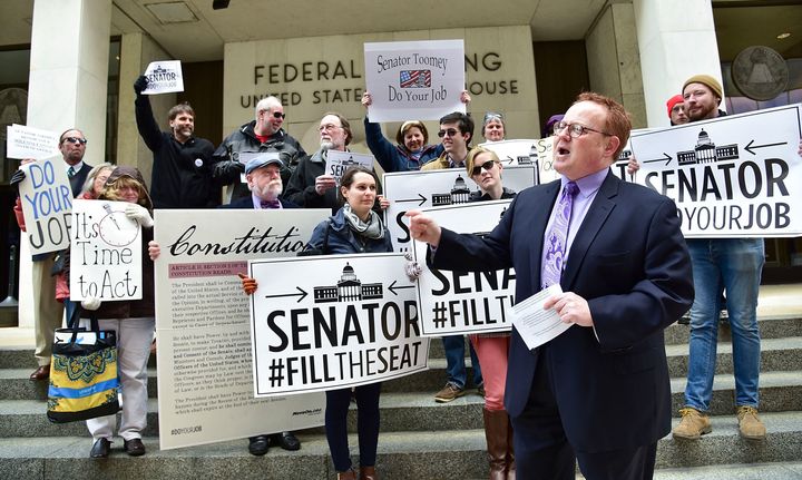 Protesters outside of Sen. Pat Toomey's (R-Pa.) Harrisburg office in March urged him to "do your job" and vote on President Obama's Supreme Court nominee. The pressure to look bipartisan may be getting to him.