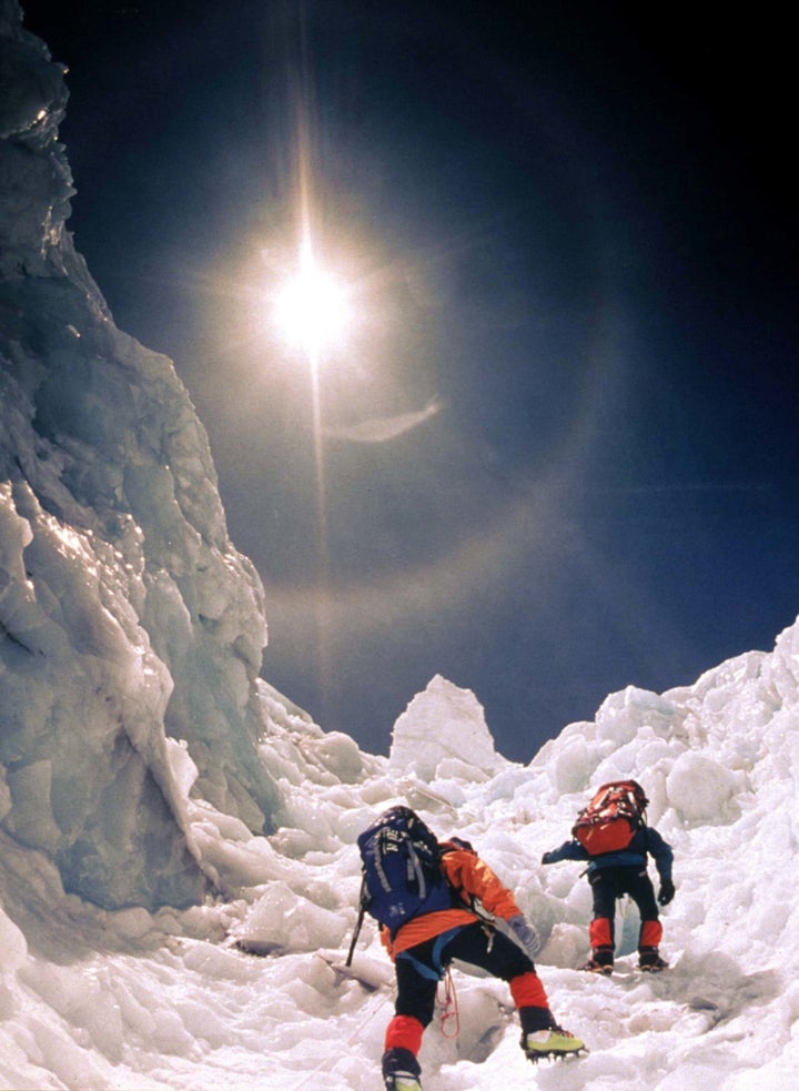 Two climbers scale the treacherous Khumbu Icefall in May 1996. 