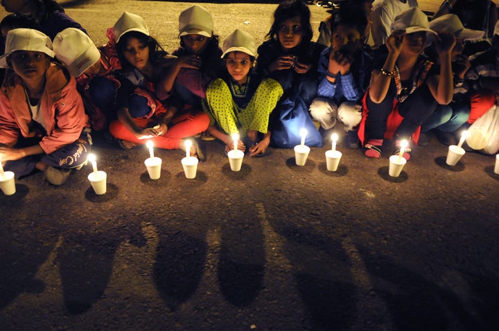 NEW DELHI, INDIA NOVEMBER 22: Children take part in a candle light vigil to end child slavery oragnized by NGO Bachpan Bachao