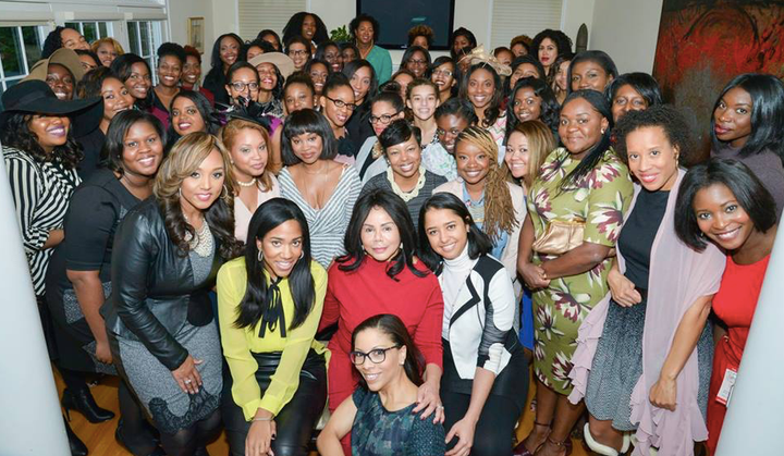 Members of ColorComm pose together for a picture at a network gathering.