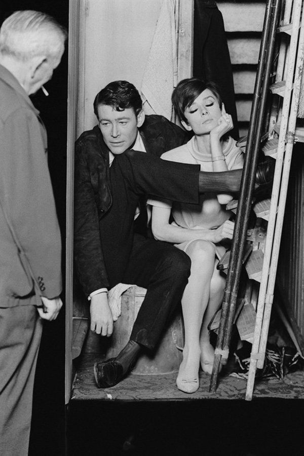 Actors Peter O'Toole and Audrey Hepburn get uncomfortable together in a cramped broom cupboard in a scene from the crime caper "How to Steal a Million," 1966.