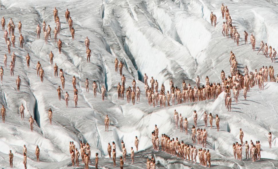 Naked volunteers pose for U.S. photographer Spencer Tunick on the Aletsch glacier on August 18, 2007. Tunick held the photo s