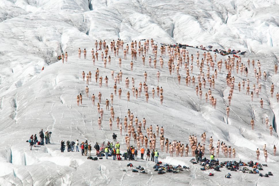 Naked volunteers pose for U.S. photographer Spencer Tunick on the Aletsch glacier on August 18, 2007. Tunick held the photo s