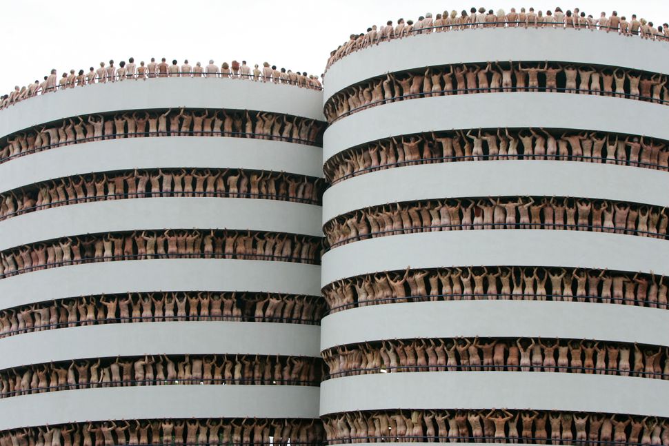 Naked volunteers pose for U.S. photographer Spencer Tunick in the Europarking building in Amsterdam on June 3, 2007.&nbsp;
