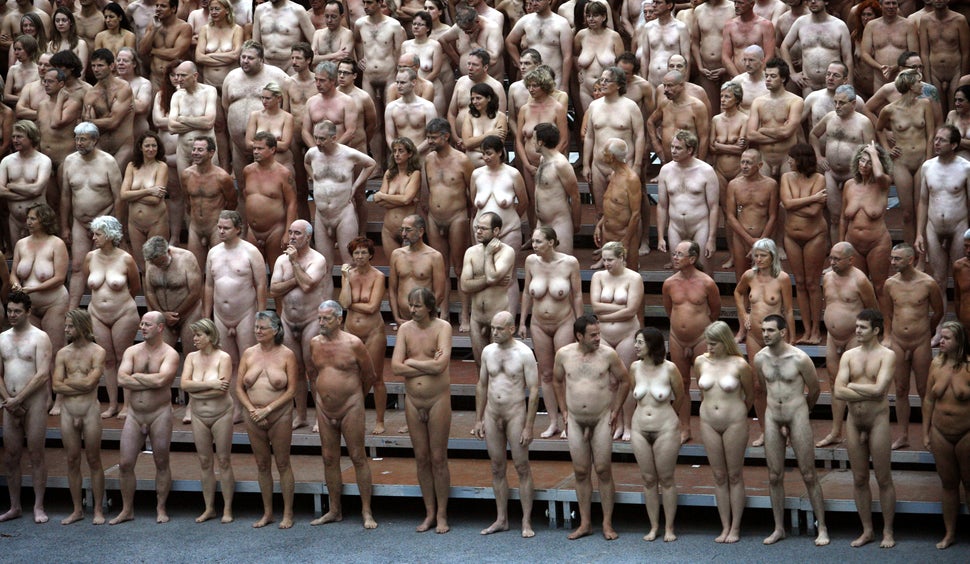 Hundreds of naked volunteers pose for U.S. photographer Spencer Tunick creating a three-dimensional body sculpture at the Mus