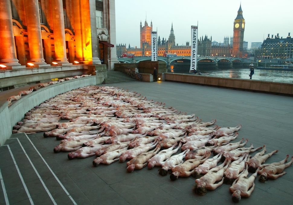 Volunteers pose naked for U.S. artist Spencer Tunick's installation during the opening of the new Saatchi Gallery in London o