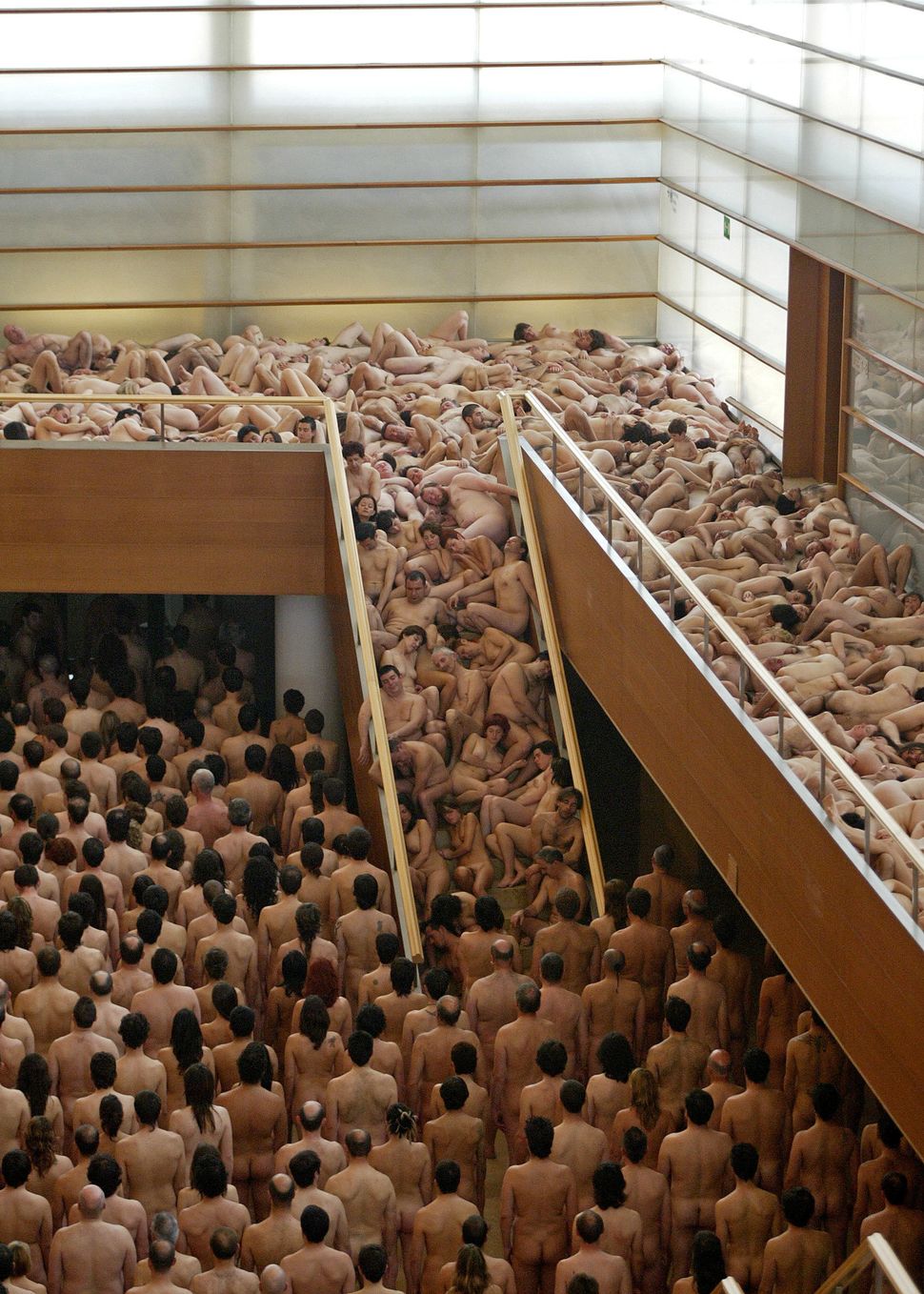Hundreds of naked volunteers pose for U.S. photographer Spencer Tunick at San Sebastian's Kursaal auditorium on April 22, 200