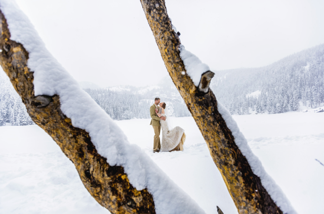 The couple pose for a portrait in Rocky Mountain National Park, where they tied the knot.