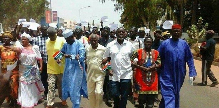 Protesters are seen marching on April 16 in Banjul. Gambia has seen rare demonstrations over electoral reforms and the imprisonment of opposition members.