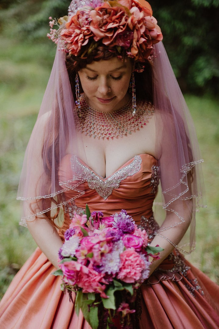 The bride, <a href="http://www.maidenmay.com/" target="_blank" role="link" data-ylk="subsec:paragraph;itc:0;cpos:__RAPID_INDEX__;pos:__RAPID_SUBINDEX__;elm:context_link">who designs costumes</a>, made some changes to the original gown by adding a bow in the back and creating a custom hoop skirt to go underneath.