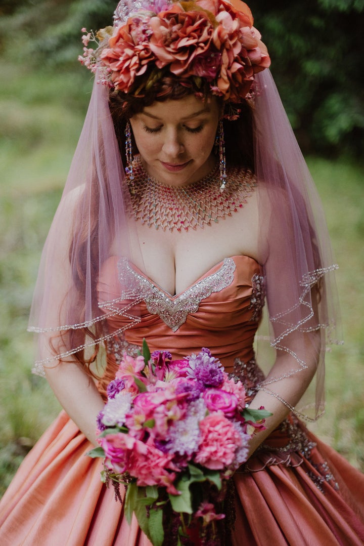 The bride, who designs costumes, made some changes to the original gown by adding a bow in the back and creating a custom hoop skirt to go underneath.