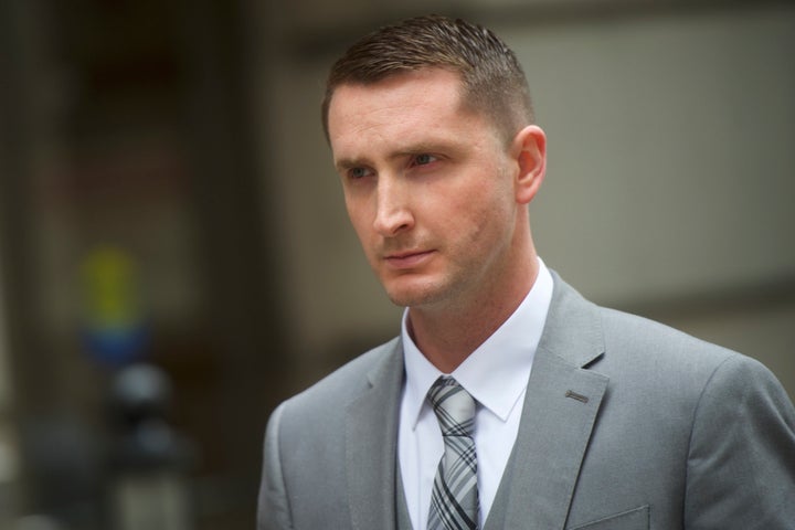 Edward Nero, a Baltimore police officer who was involved in Freddie Gray's arrest, exits the Baltimore City Circuit Court for a lunch recess during the first day of his trial Thursday in Baltimore.