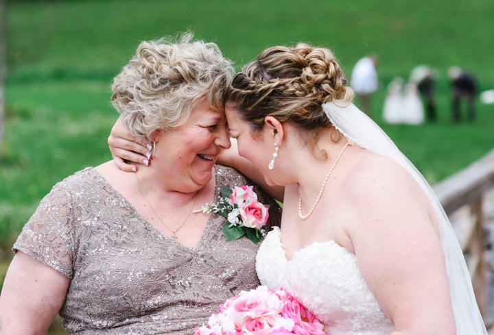 Joy and Lauren pose at the May 7 wedding.