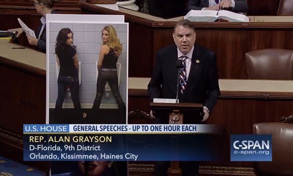 Here's Rep. Alan Grayson (D-Fla.) on the House floor with a poster of women peeing in urinals.