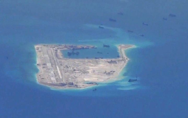 Chinese dredging vessels are purportedly seen in the waters around Fiery Cross Reef in the disputed Spratly Islands in the South China Sea.
