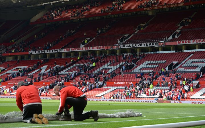 Fans leave the Sir Alex Ferguson stand