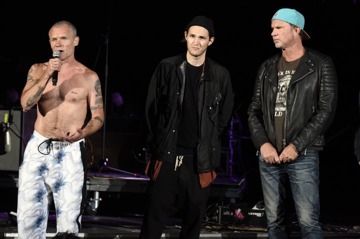 From left, band members Flea, Josh Klinghoffer and Chad Smith took the stage to announce that they would not be performing due to a medical emergency.