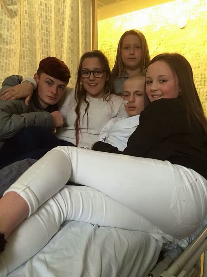 <strong>Kallum Aish pictured in hospital besides his friends, including Daniel Bradbury, far left</strong>