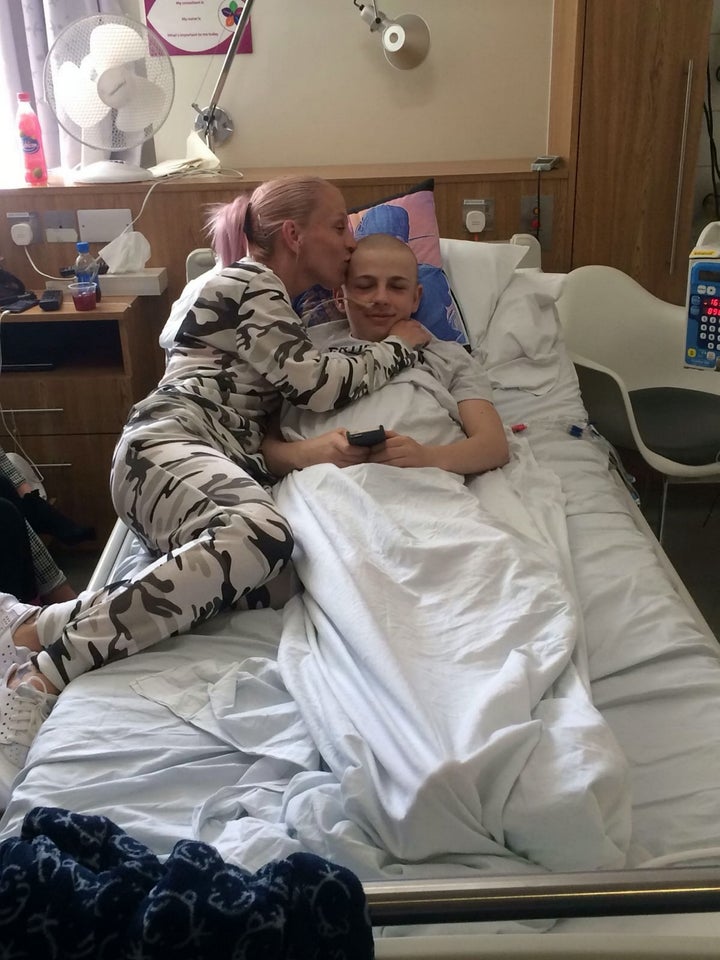 Kallum's mum Jamie comforts her son in hospital