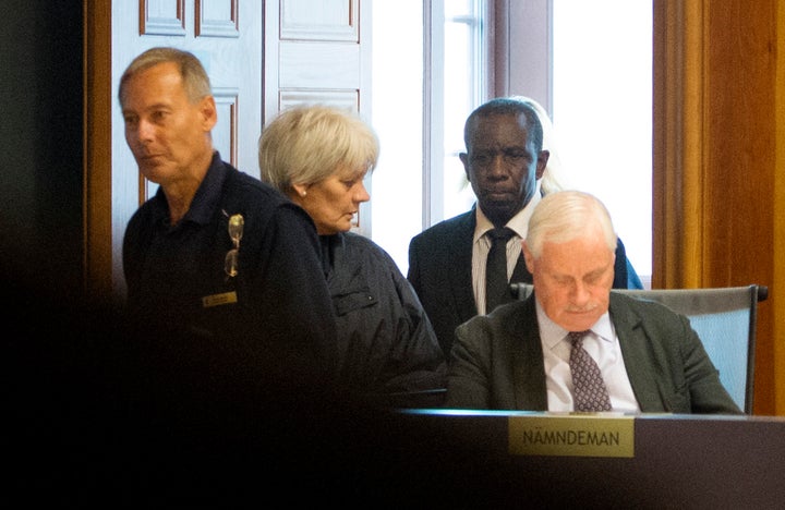 Claver Berinkindi, pictured second from the right, has been sentenced to life imprisonment for his "informal role as a leader" in the 1994 Rwandan genocide.