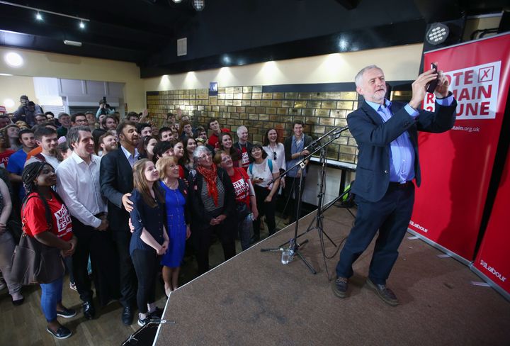 Jeremy Corbyn taking selfies at a student registration rally