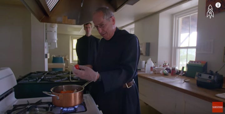 Father Richard Walz uses gloves to handle a hot Habanero pepper. 