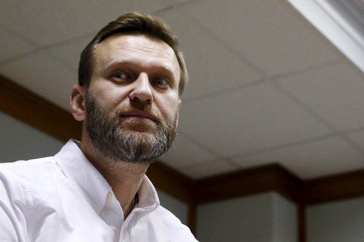 Russian anti-corruption campaigner Alexei Navalny and fellow activists were attacked at an airport by assailants described as Cossacks.