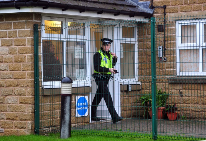 Police outside the premises where the two girls died