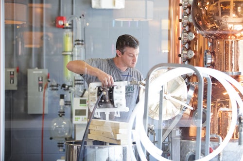 Lee Katrincic is head distiller at Durham Distillery in Durham, North Carolina. The distillery makes Conniption "American Dry" and "Navy Strength" gins, as well as a line of liqueurs.