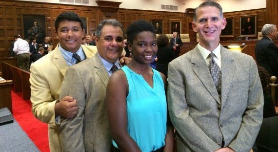 Michael De Leon, second from left, and Greg Bourke, far right, are seen with their children in 2014. De Leon and Bourke want a headstone design celebrating their victory at the Supreme Court.