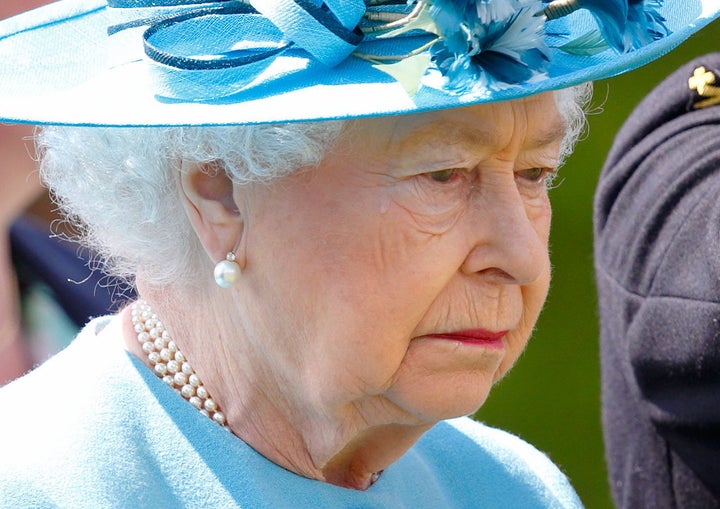 Queen Elizabeth II sheds a tear at the unveiling of a new memorial.