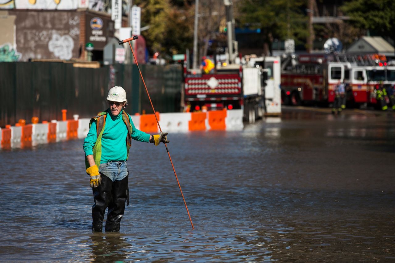 A first responder from at the site of a water main break in the Queens borough of New York City in October 2015.