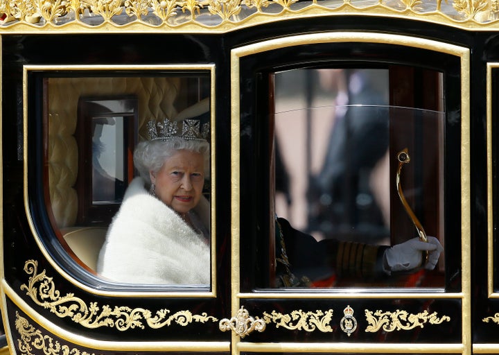 <strong>The Queen travels to the Houses of Parliament in her horse-drawn carriage</strong>
