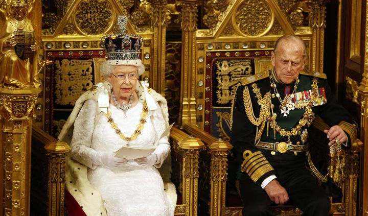 Queen Elizabeth II reads the Queen's Speech as Prince Philip listens during the State Opening of Parliament in the House of Lords