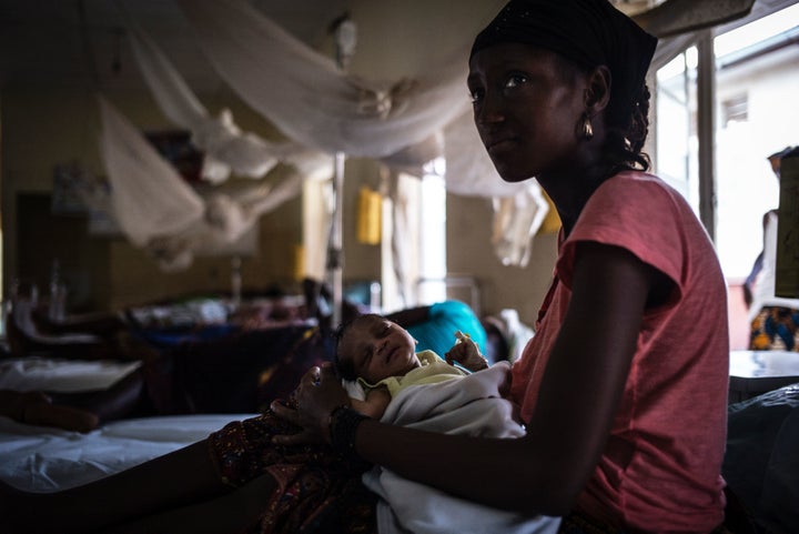 A mother nurses her newborn at the maternity ward of the Kailahun Government hospital in eastern Sierra Leone.
