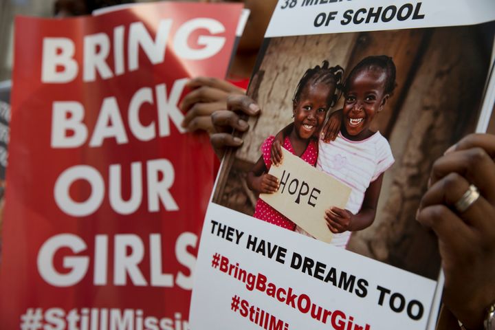 <strong>Protesters holds up placards demanding help from the Nigerian government to find hundreds of Chibok girls.</strong>
