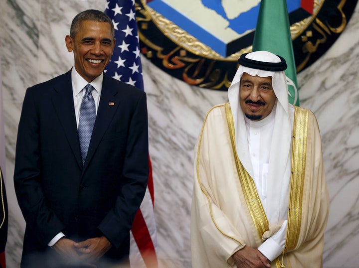 President Barack Obama stands next to Saudi Arabia's King Salman in Riyadh, Saudi Arabia, April 21, 2016.