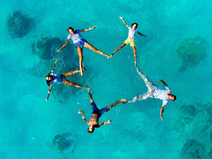 A wedding party poses for Havard's drone.