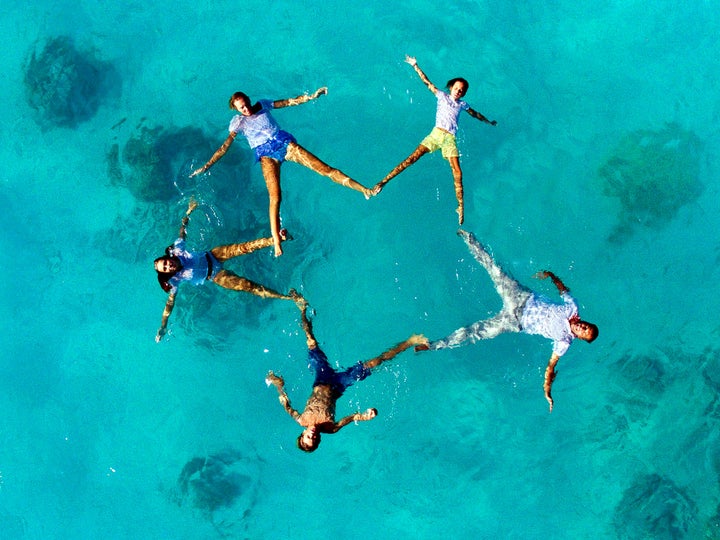 A wedding party poses for Havard's drone.