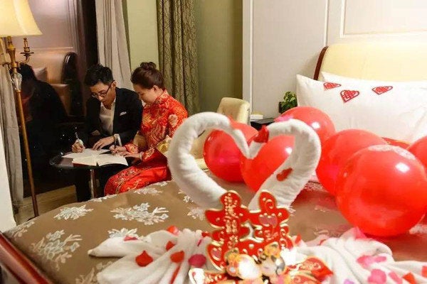 The couple's employer, state-owned Nanchang Railway Bureau, has been getting its employees to copy out the Chinese constituti