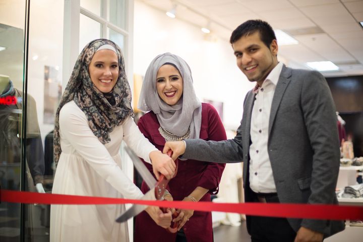 From left to right: Lisa Vogl, Nadine Abu-Jubara, and Hassan Mawji at the opening day ceremony for the Verona Collection. 