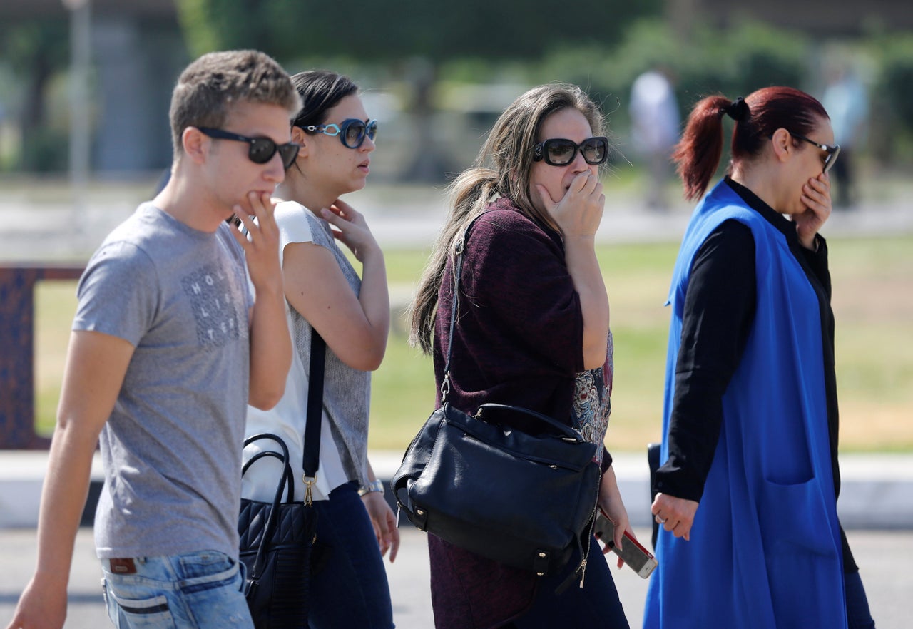 Relatives and friends of passengers wait at Cairo Airport.