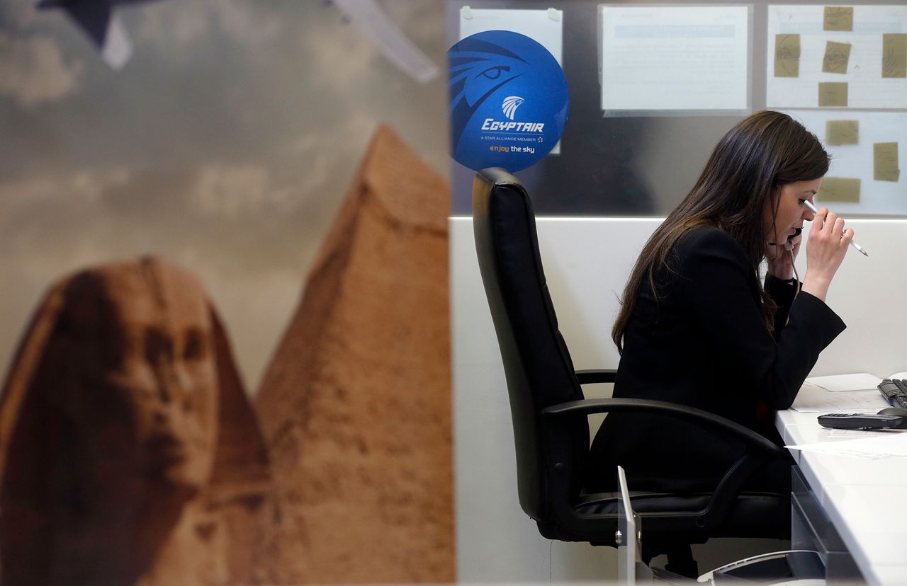 <strong>An employee works at the EgyptAir desk at Charles de Gaulle airport after news of the disaster broke.</strong>