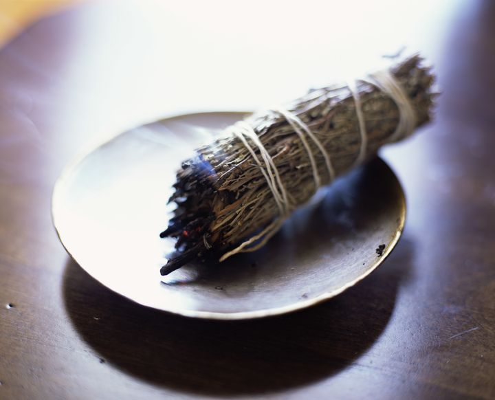 The smoke from sage or incense can be clearing, according to Scher. 