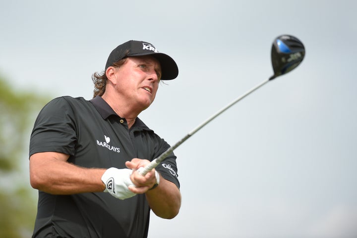 Phil Mickelson follows his drive off the 11th tee box during first round of the Cadillac Championship at TPC Blue Monster at Trump National Doral.