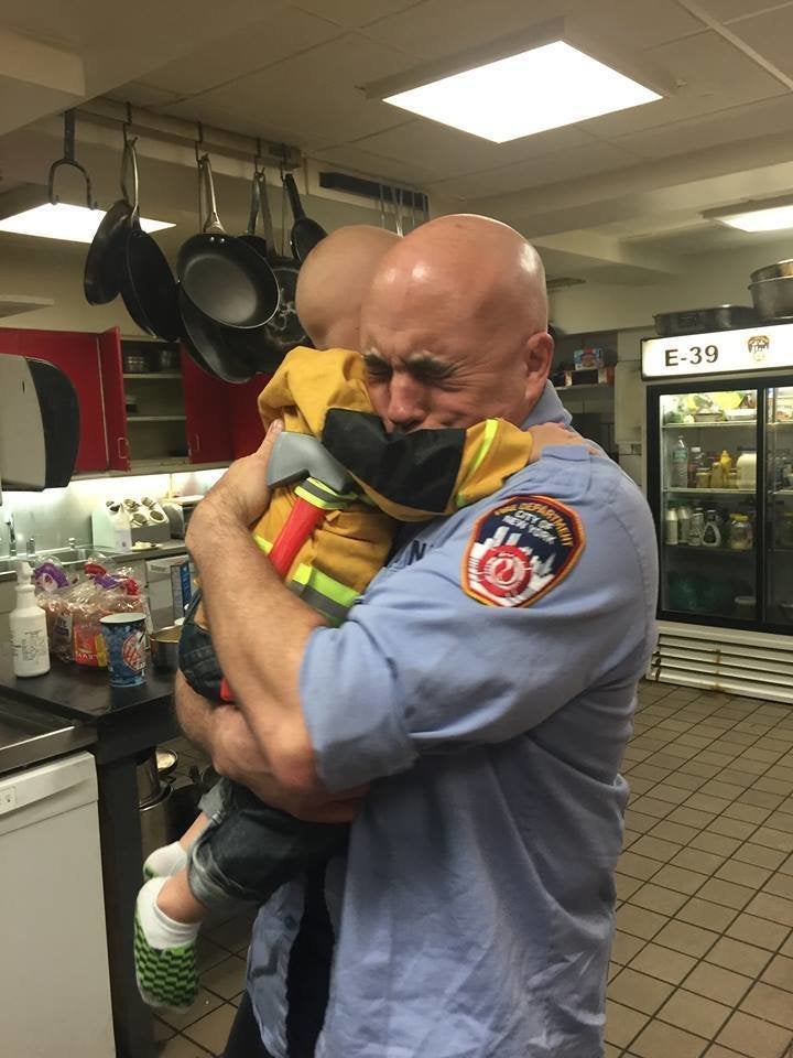 This photo of Trucker Dukes hugging FDNY Captain Jim Grismer prompted the boy's invitation to become an honorary firefighter of New York.