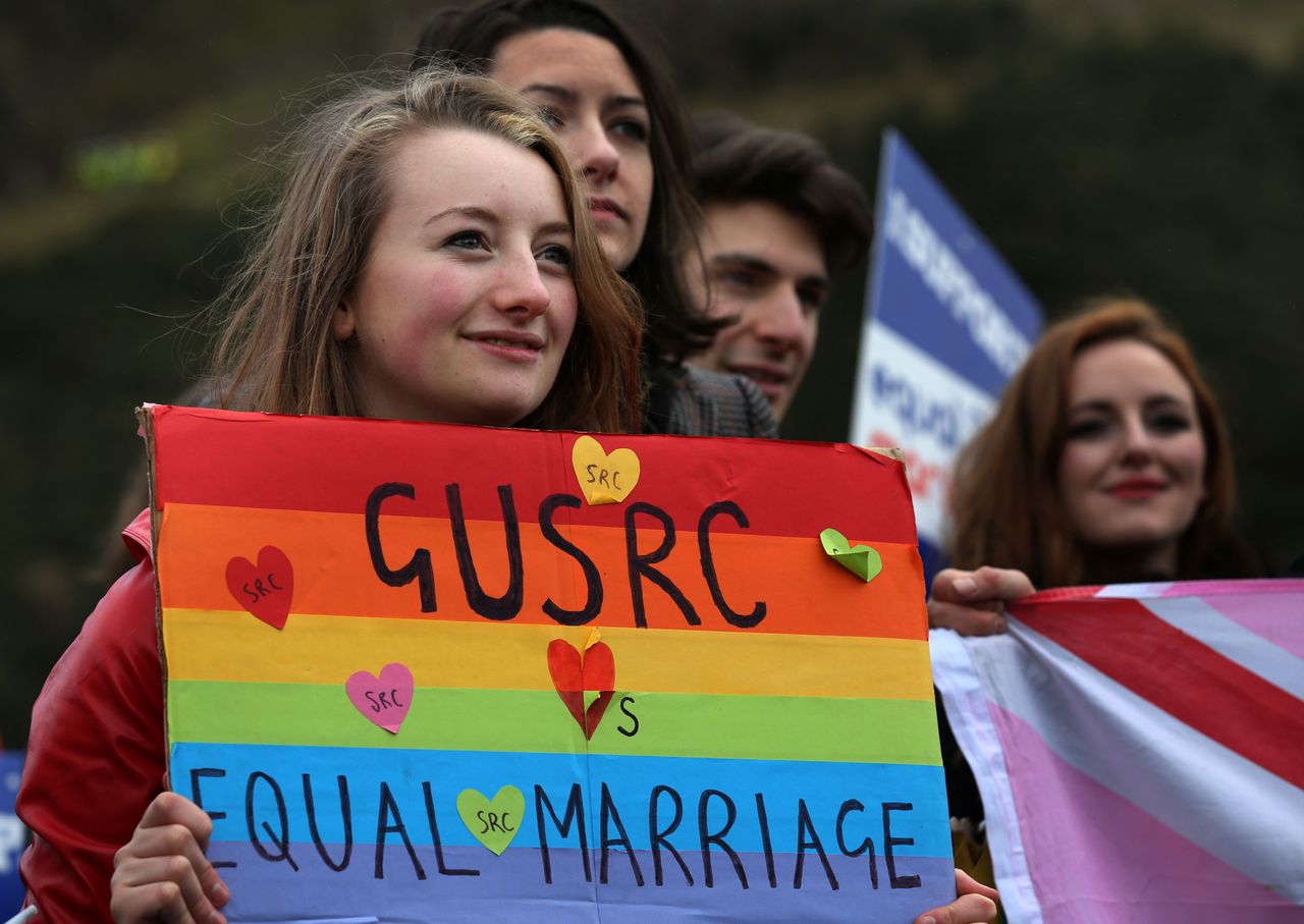 Students campaign outside Holyrood in Edinburgh on the day MSPs met to vote on whether to legalise same-sex marriage