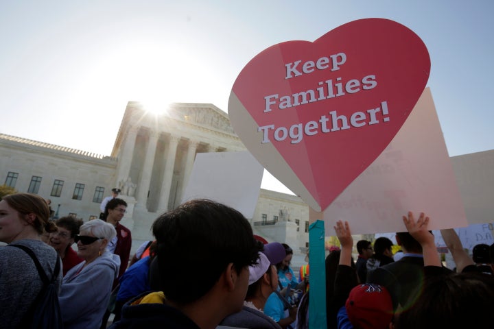 Immigration activists rally outside the U.S. Supreme Court as it hears arguments over the legality of President Barack Obama's executive actions on immigration.