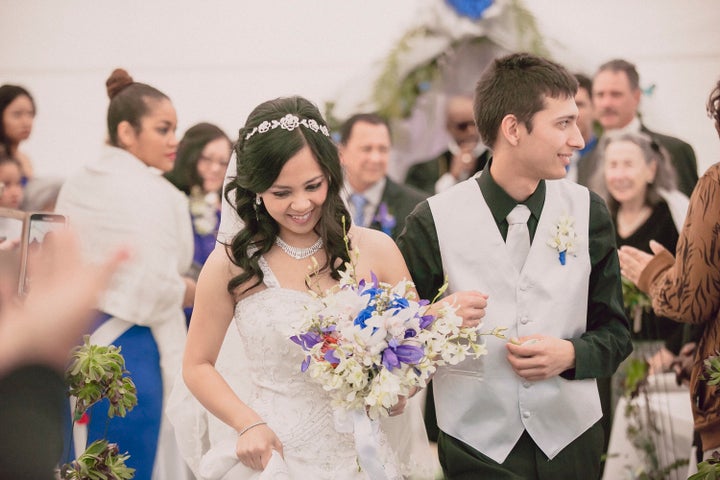 Krystel and Earle walk down the aisle after exchanging vows.