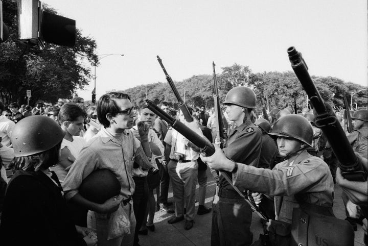 Protesters face off with armed National Guardsmen in Chicago during the 1968 Democratic National Convention.